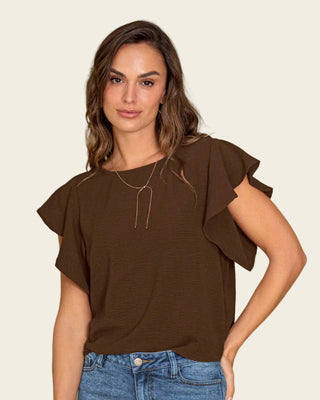 Blusa con boleros en mangas en tela craquelada#color_c23-cafe