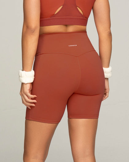 Short ciclista con bolsillo lateral y compresión de abdomen#color_336-rojo-canela