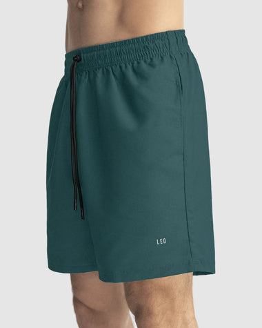 Pantaloneta deportiva con bolsillos funcionales#color_678-verde