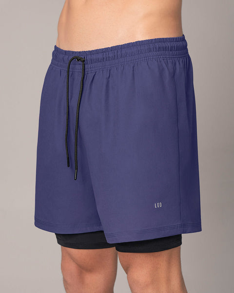 Pantaloneta deportiva con bolsillo lateral con bóxer interno#color_522-estampado-camuflado-azul