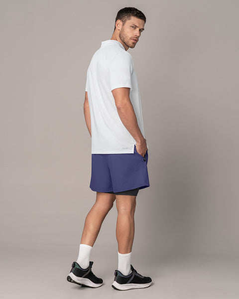 Pantaloneta deportiva con bolsillo lateral con bóxer interno#color_522-estampado-camuflado-azul