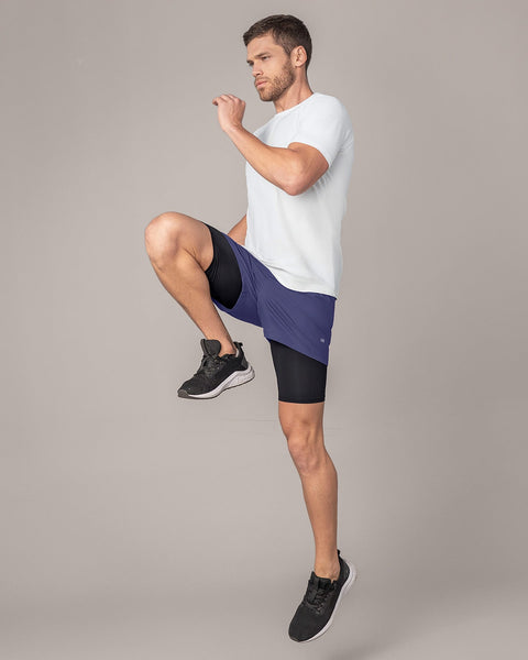 Pantaloneta deportiva con bolsillo lateral con bóxer interno#color_522-estampado-camuflado-azul