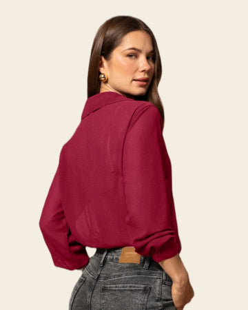 Blusa-manga-larga-elaborada-en-tela-con-transparencia#color_c34-vino