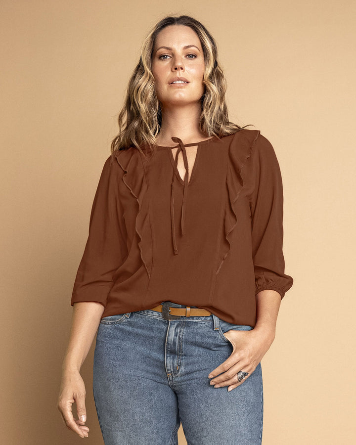 Blusa manga 3/4 con boleros sobrepuestos en frente