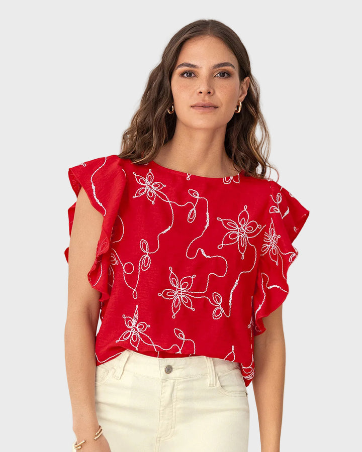 Blusa en tela bordada con bolero en mangas