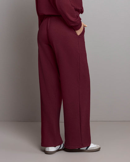 Pantalón bota amplia con elástico y tira anudable en cintura#color_c37-borgona