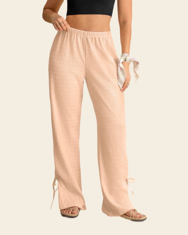Pantalón amplio con textura y lazos en bota